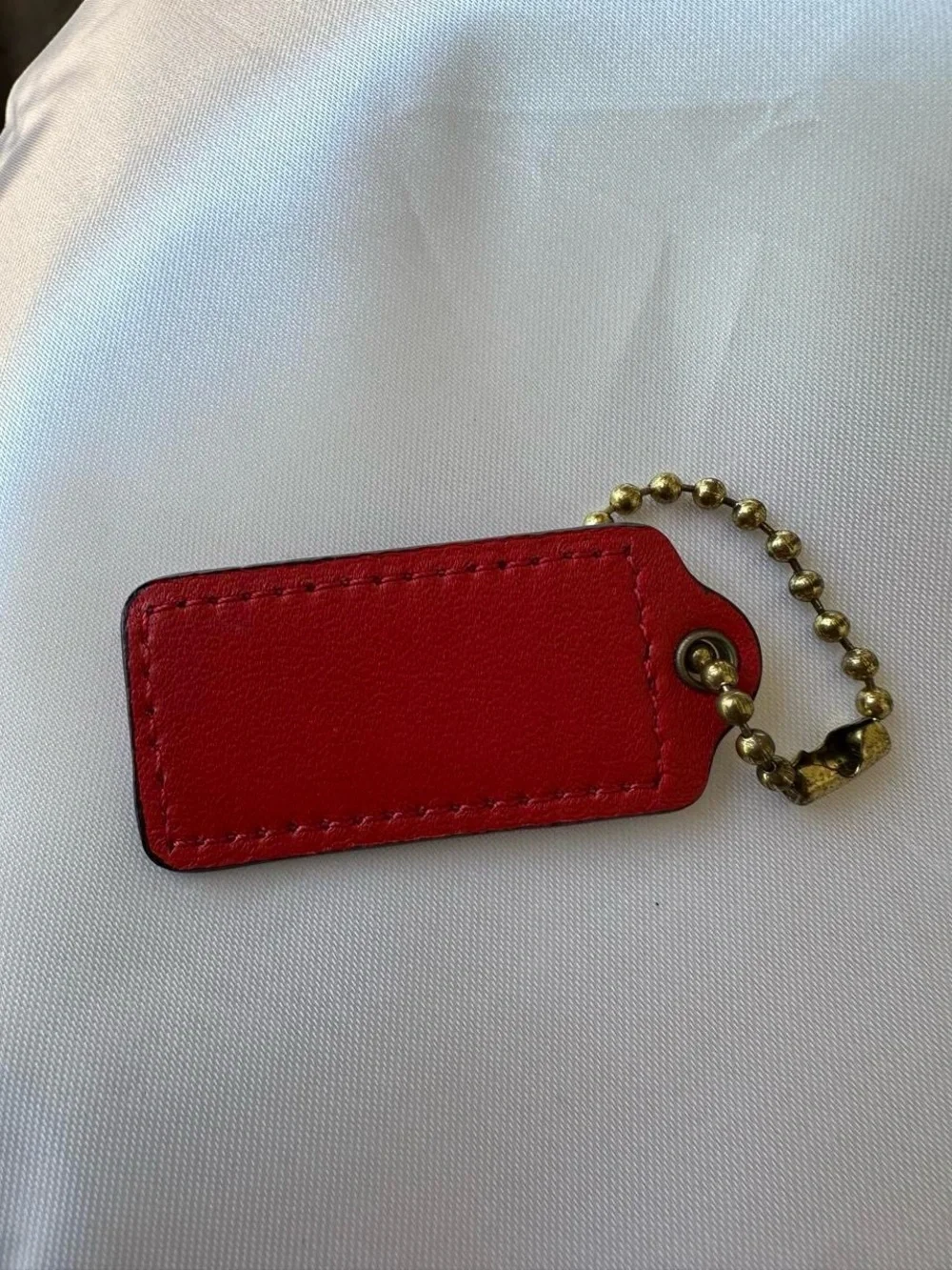 COACH Red Leather Hang Tag with Gold Chain